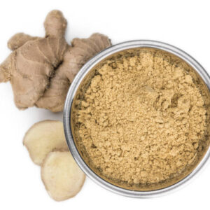 Portion of ground ginger isolated on white background (selective focus)