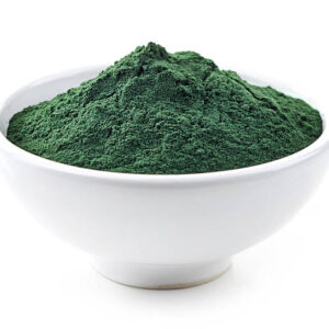 Bowl of spirulina algae powder isolated on white