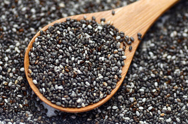 Raw organic black chia seeds, close up image